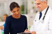 Doctor speaking with woman
