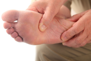 Person massaging foot